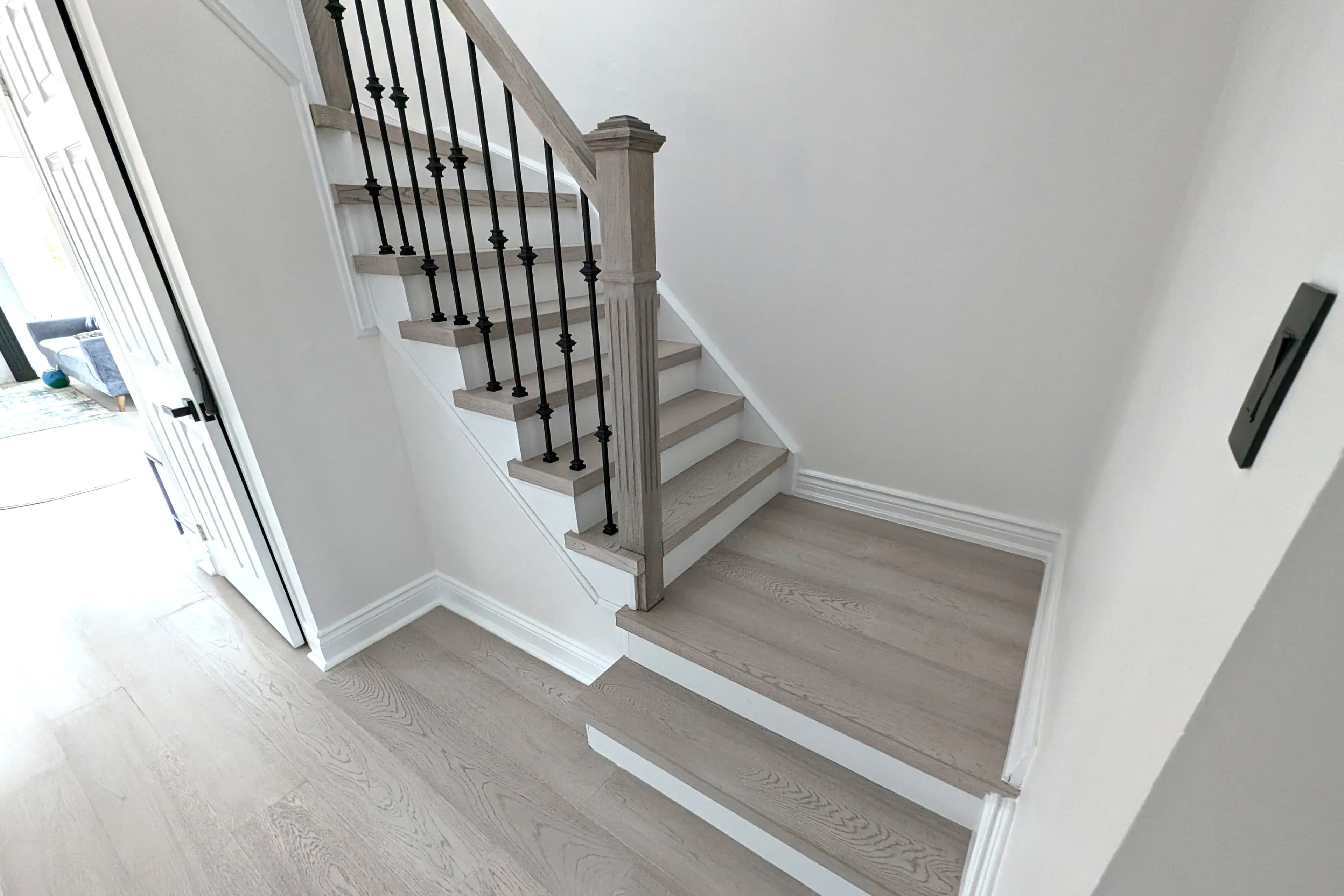 Custom stair treads fabricated from flooring material to match the surrounding floor